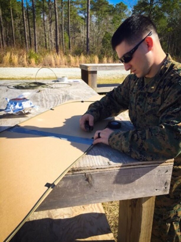 On March 10, 2016 Second Lieutenant Erik Henegar, a Marine attached to Combat Engineer Officers course 3-16 (CEO 3-16); puts together an oval charge to breach a roof during the Urban Mobility Breaching class. This class teaches the officers different mechanical and explosive breaching capabilities of combat engineers.