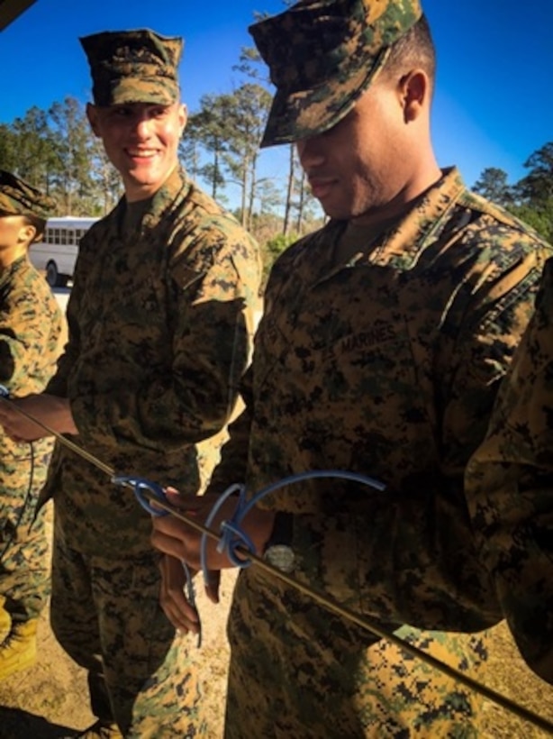 On March 2, 2016 Second Lieutenants Eric Johnson and Eric Mederos, Marines attached to Combat Engineer Officers course 3-16 (CEO 3-16); practice tying a girth hitch with an extra turn during a military demolitions class. This type of knot is used to create branch line connections which are lengths of detonation cord used to prime charges. 
