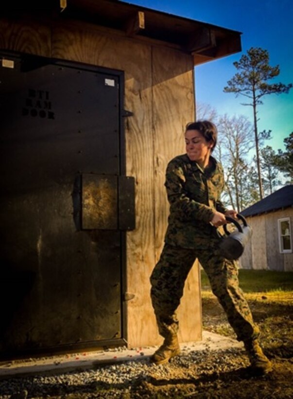 On March 10, 2016 Second Lieutenant Abigail Nagel, a Marine attached to Combat Engineer Officer course 3-16 (CEO 3-16) aboard Camp Lejeune, N.C.; uses a breaching ram to breach a door during an urban mobility breaching class. This class taught the officers different mechanical and explosive breaching capabilities and methods.
