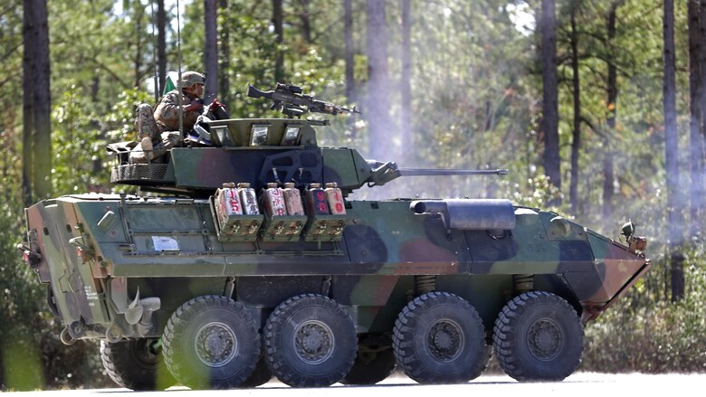 Marines operating a Light Armored Vehicle with 2nd Light Armored Reconnaissance Battalion fire a M242 Bushmaster 25 mm chain-driven auto-cannon during the unit’s annual gunnery qualification at Marine Corps Base Camp Lejeune, North Carolina, March 18, 2016. The purpose of the training was to increase readiness and ensure that the Marines maintain their proficiency employing the weapons. 