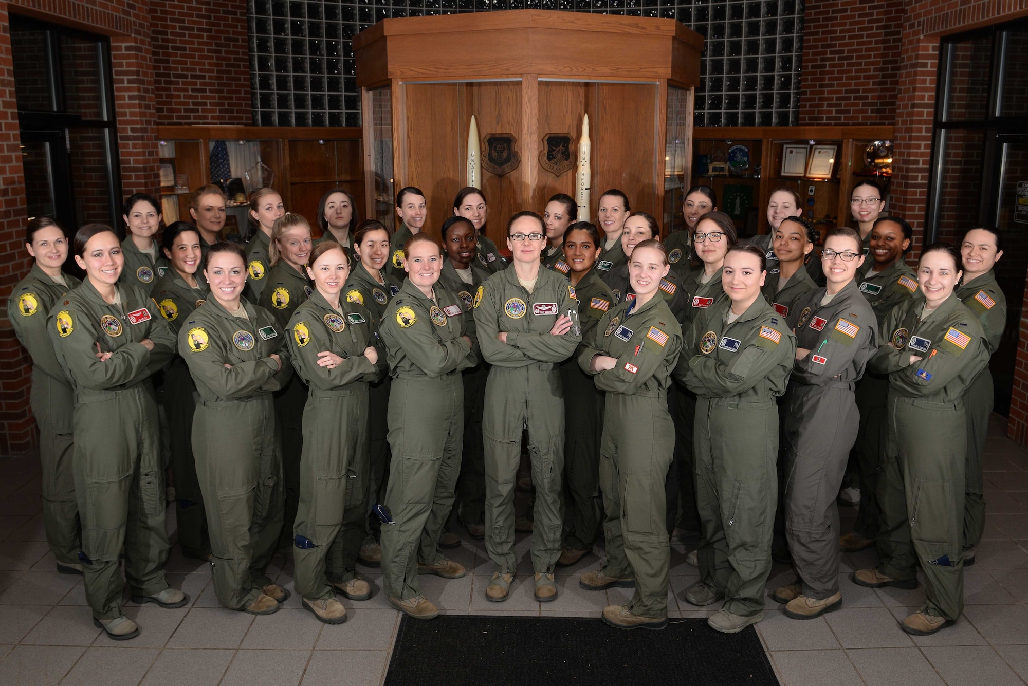 91st Missile Wing members pose for a photo in honor of Women's History month. (U.S. Air Force photo/Airman 1st Class Jessica Weissman)