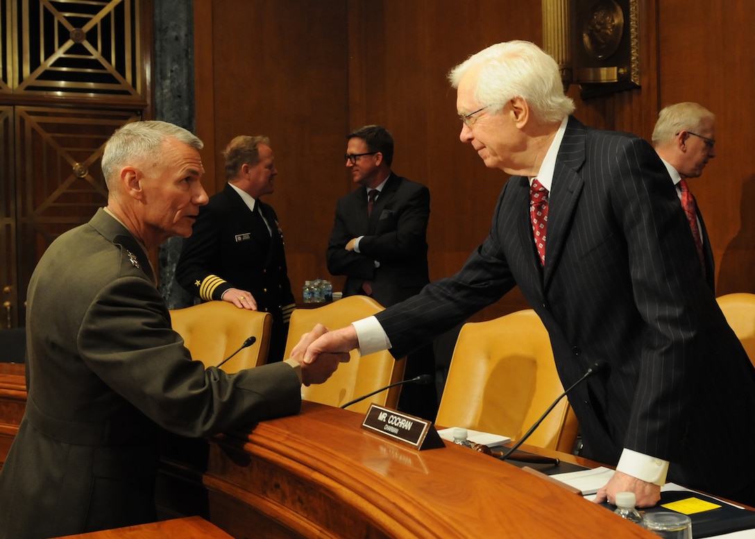 Lt. Gen. Rex C. McMillian (left), commander of Marine Forces Reserve, greets Sen. Thad Cochran (right), chairman of the Senate Appropriations Committee, at a congressional hearing March 16, 2016, in Washington. McMillian joined National Guard and Reserve leaders from other military branches to discuss the fiscal year 2017 budget request before the Senate Appropriations Committee’s defense subcommittee hearing. (U.S. Army National Guard photo by Staff Sgt. Michelle Gonzalez/Released)