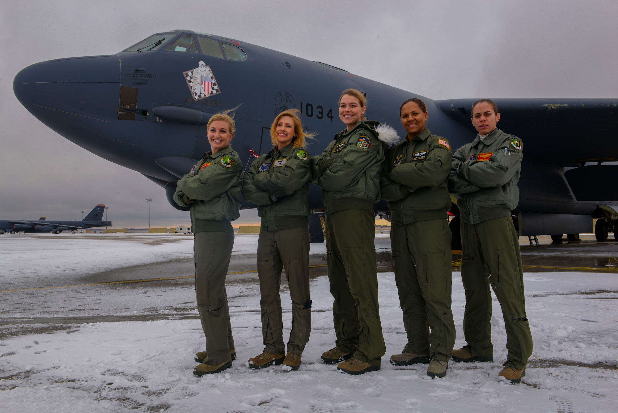B-52 aircrew members pose for a photo in honor of Women's History month. Female missiliers and aircrew honored women before them by serving as an all-female crew on alert and in the B-52. (U.S. Air Force photo/Airman
1st Class Jessica Weissman)
