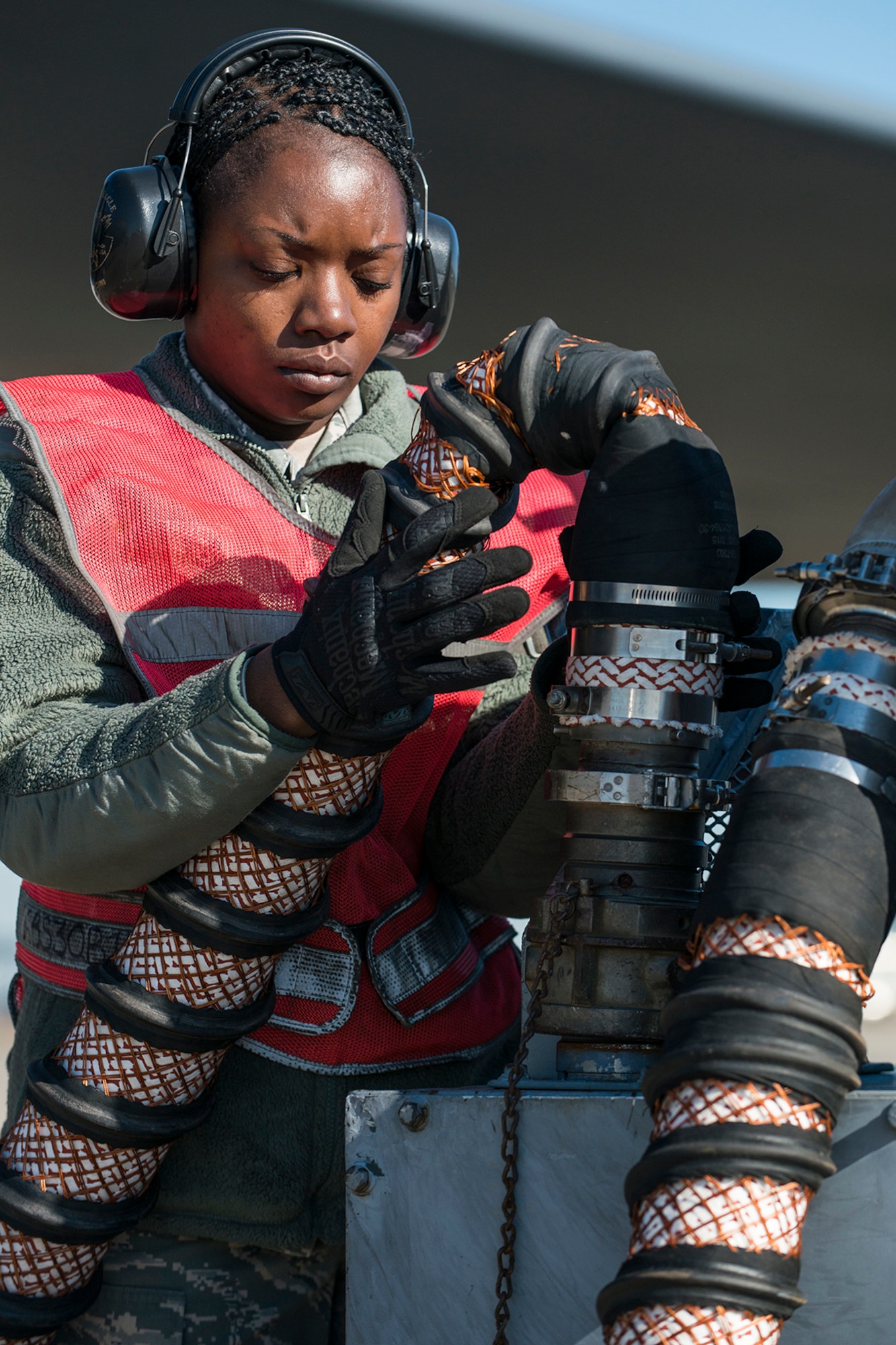 U.S. Air Force Tech. Sgt. Holly Guerra, assigned to the 307th Aircraft Maintenance Squadron, stows an air hose used to start engines on a B-52H Stratofortress on Mar. 22, 2013, Barksdale Air Force Base, La. In recognition of Women’s History Month, the Air Force Reserve Command’s 307th Bomb Wing and Barksdale’s 2nd Bomb Wing launched two B-52H Stratofortress bombers flown by two all-female aircrews made up from members of the Air Force Reserve Command’s 93rd and 343rd Bomb Squadrons and the 2nd Bomb Wing’s 11th, 20th and 96th Bomb Squadrons. (U.S. Air Force photo by Master Sgt. Greg Steele/Released)