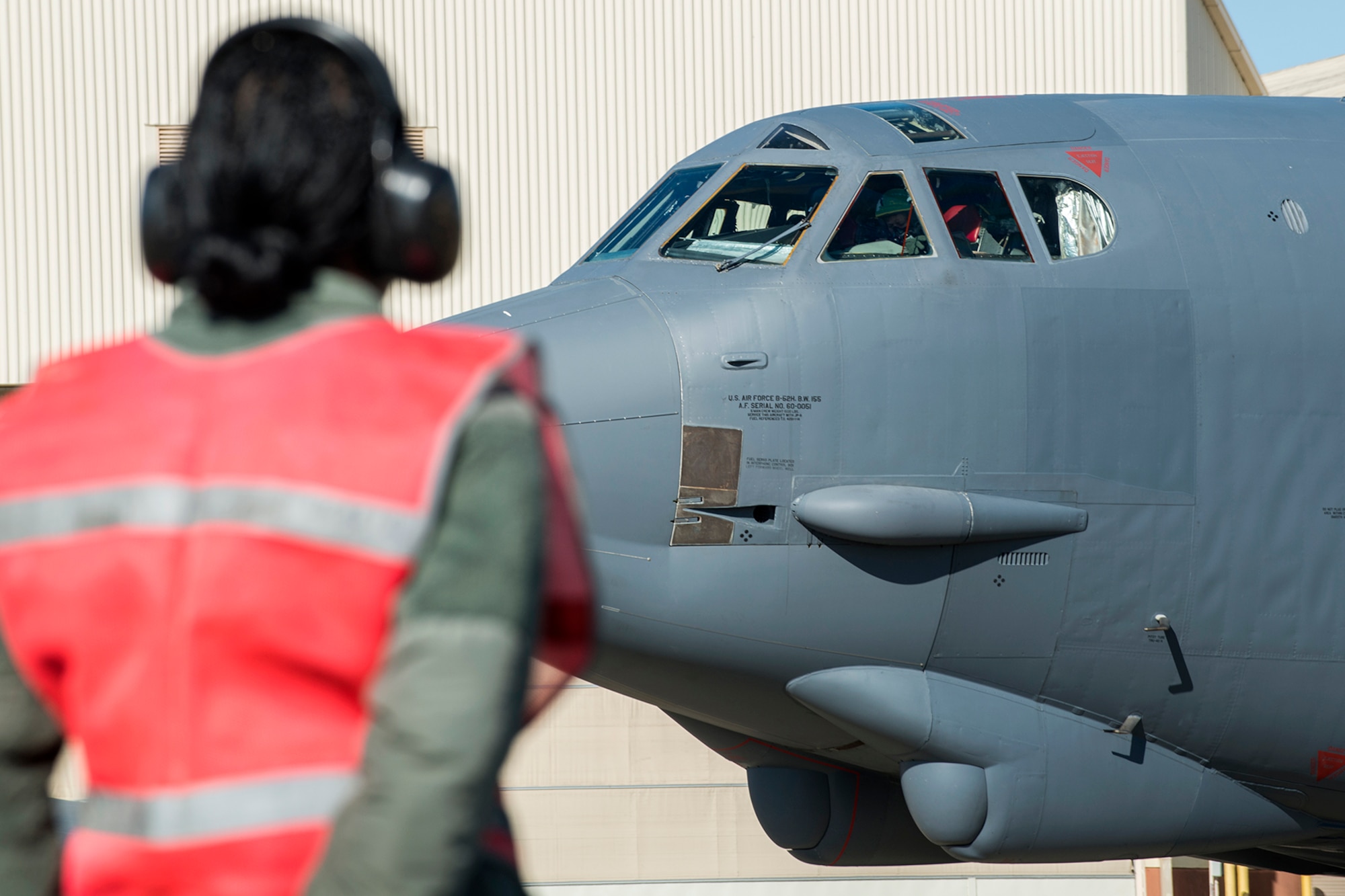U.S. Air Force Tech. Sgt. Holly Guerra, assigned to the 307th Aircraft Maintenance Squadron, prepares to marshal a B-52H Stratofortress from its parking spot for a mission on Mar. 22, 2013, Barksdale Air Force Base, La. In recognition of Women’s History Month, the Air Force Reserve Command’s 307th Bomb Wing and Barksdale’s 2nd Bomb Wing launched two B-52H Stratofortress bombers flown by two all-female aircrews made up from members of the Air Force Reserve Command’s 93rd and 343rd Bomb Squadrons and the 2nd Bomb Wing’s 11th, 20th and 96th Bomb Squadrons. (U.S. Air Force photo by Master Sgt. Greg Steele/Released)
