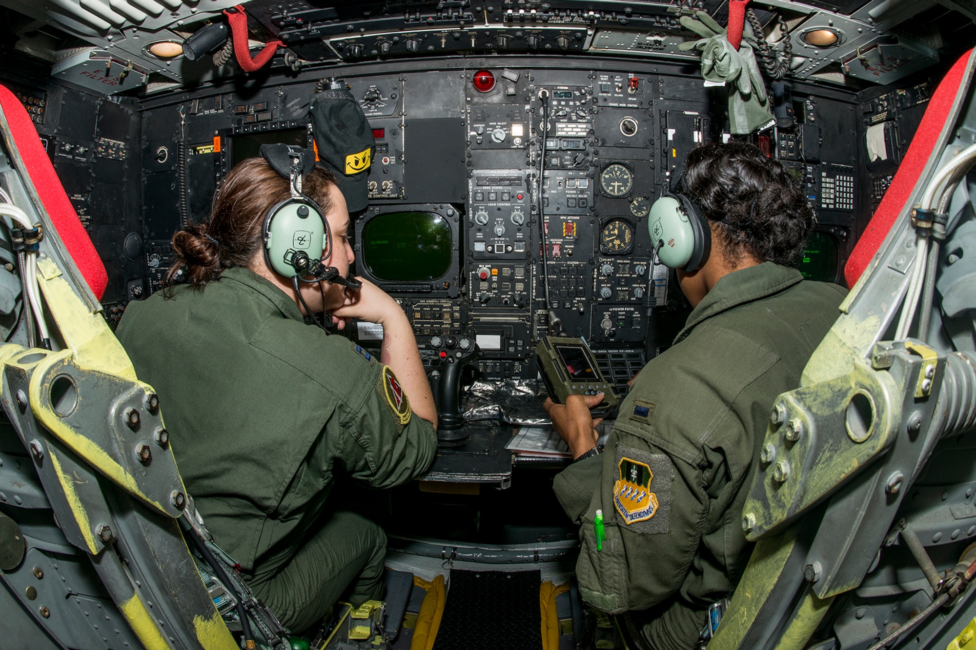 Two U.S. Air Force B-52 navigators prepare for a mission on Mar. 22, 2013, Barksdale Air Force Base, La. In recognition of Women’s History Month, the mission consisted of two B-52H Stratofortress bombers flown by two all-female aircrews made up from members of the Air Force Reserve Command’s 93rd and 343rd Bomb Squadrons and the 2nd Bomb Wing’s 11th, 20th and 96th Bomb Squadrons. (U.S. Air Force photo by Master Sgt. Greg Steele/Released)
