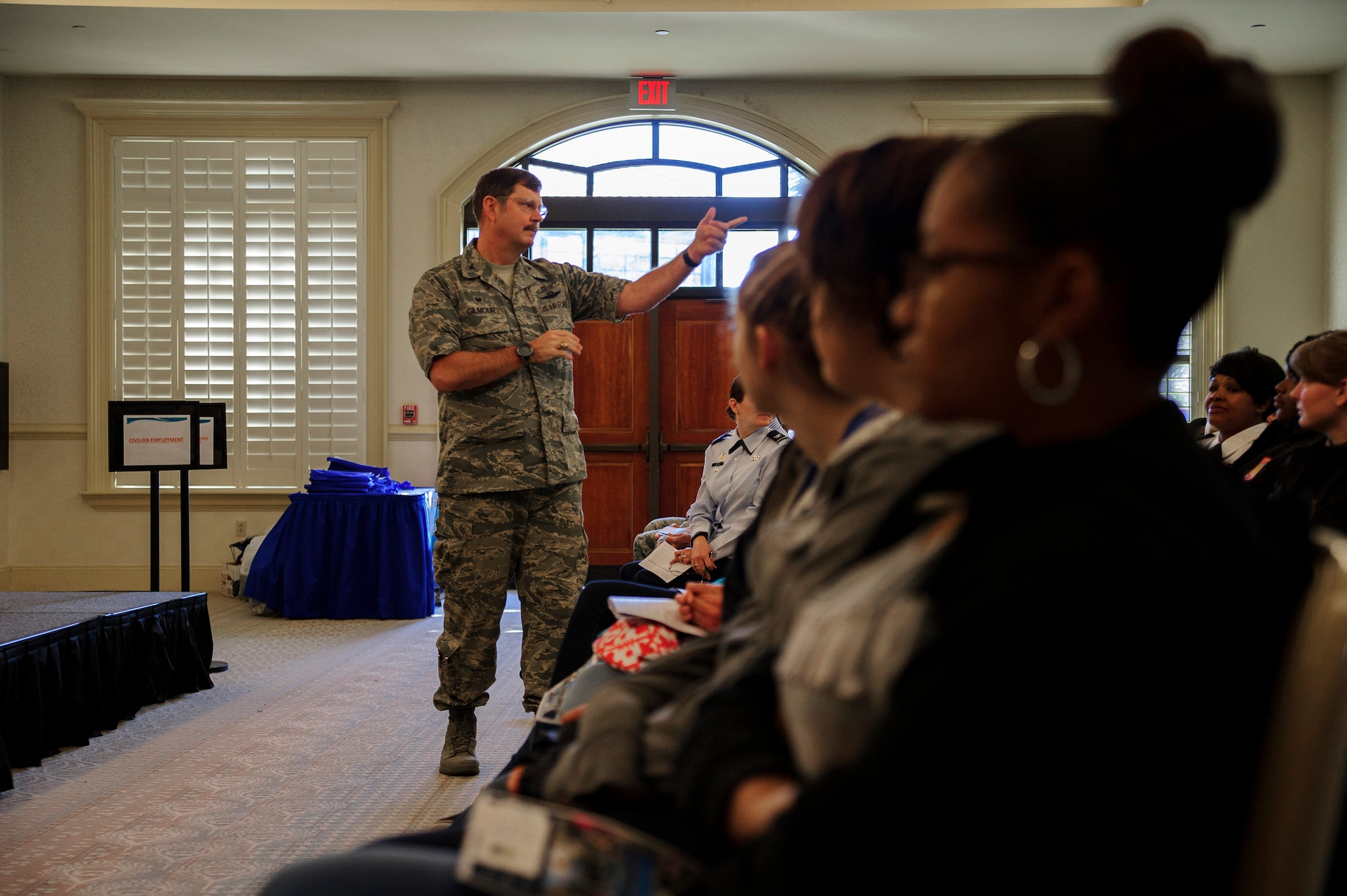 Col. Gregory Gilmour, 315th Airlift Wing commander, welcomes Lowcountry school girls to the 9th Annual Women in Aviation Career Day. Over 130 middle and high school girls from 12 Lowcountry schools visited Joint Base Charleston March 22 to learn about jobs in aviation as part of the 315th Airlift Wing event.	(U.S. Air Force photo by Senior Airman Jonathan Lane)