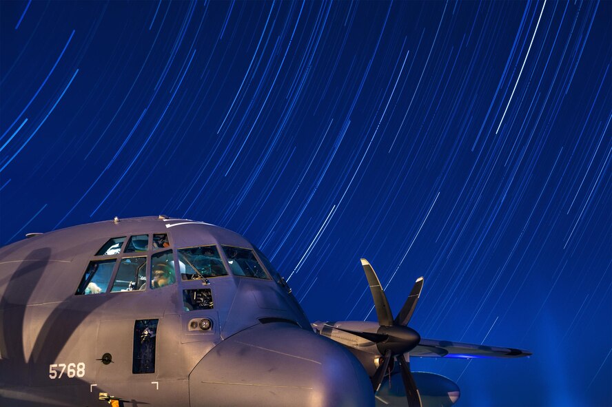 In this composite photo stars travel across the sky over the course of two hours as maintainers from the 71st Aircraft Maintenance Unit work in the cockpit of an HC-130J Combat King II, March 23, 2016, on the flightline at Moody Air Force Base, Ga. The HC-130J, assigned to the 71st Rescue Squadron, is the only fixed-wing personnel recovery platform in the Air Force inventory. The aircraft is capable of performing airdrop, helicopter air-to-air refueling, forward area ground refueling, disaster response and emergency aeromedical evacuation missions. (U.S. Air Force photo by Senior Airman Ryan Callaghan/Released)
