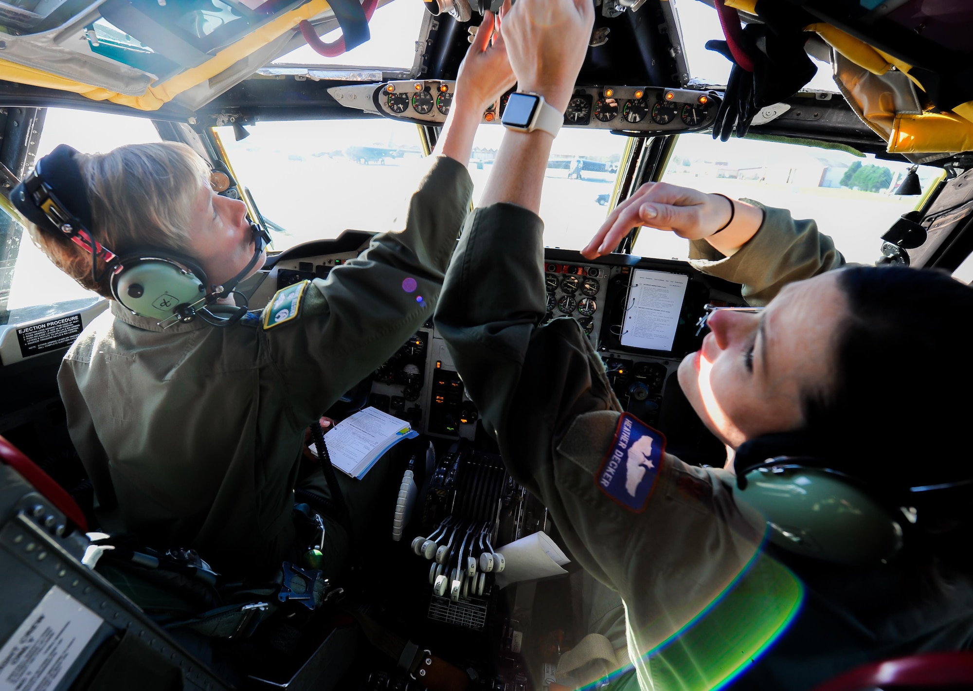 Col. Kristin Goodwin, 2nd Bomb Wing commander, and Maj. Heather Decker, 93rd Bomb Squadron instructor pilot, go through their preflight checklist prior to takeoff at Barksdale Air Force Base, La., March 22, 2016. This B-52 Stratofortress formation highlights the contributions of women who have served our country throughout American history. (U.S. Air Force photo/2nd LT. Jessica Adams)