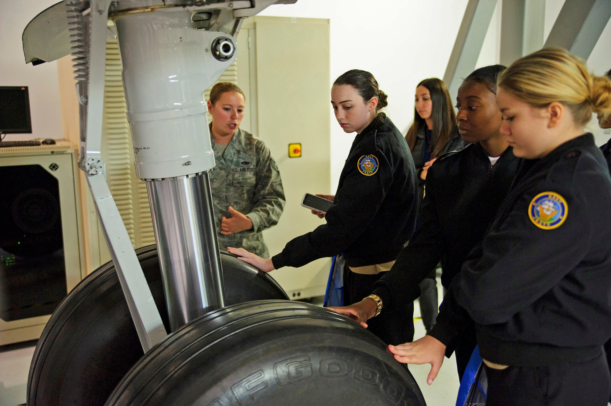 While visiting the 373rd Training Squadron Det. 5 local girls were given the opportunity to see and touch stand-alone "Hot Mockup" components of all the key components of the C-17 Globemaster III. Over 130 middle and high school girls from 12 Lowcountry schools visited Joint Base Charleston March 22 to learn about jobs in aviation as part of the 315th Airlift Wing’s 9th annual Women in Aviation Career Day. (U.S. Air Force photo by Senior Airman Jonathan Lane)