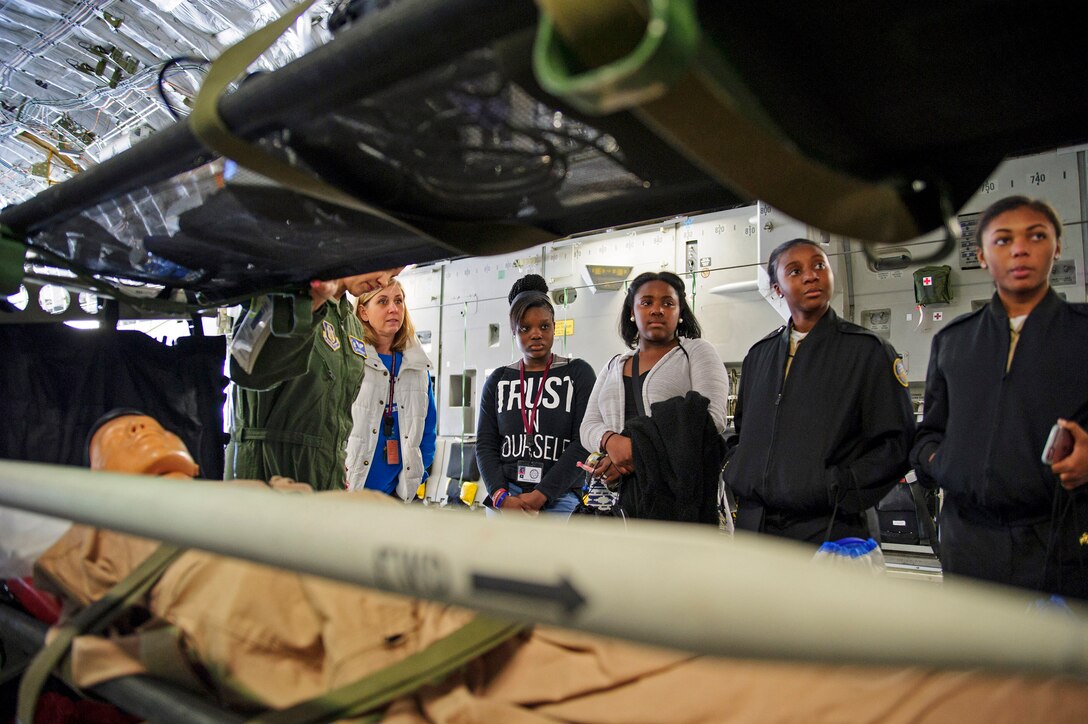Local school girls talk with 315th Aeromedical Evacuation Squadron members on a C-17 Globemaster III at the Women in Aviation Career Day. Over 130 middle and high school girls from 12 Lowcountry schools visited Joint Base Charleston March 22 to learn about jobs in aviation as part of the 315th Airlift Wing’s 9th annual Women in Aviation Career Day. (U.S. Air Force photo by Senior Airman Jonathan Lane)