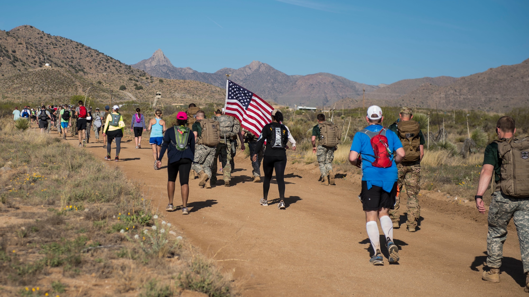 Participants in the 2016 Bataan Memorial Death March make their way through the course at White Sands Missile Range N.M., March 20. Over 6,200 participants came to honor more than 76,000 Prisoners of War and Missing in Action from Bataan and Corregidor during World War II. The 26.2-mile course starts on WSMR, enters hilly terrain and finishes through sandy desert trails, with elevation ranging from 4,100 to 5,300 feet. (U.S. Air Force photo by Senior Airman Chase Cannon)