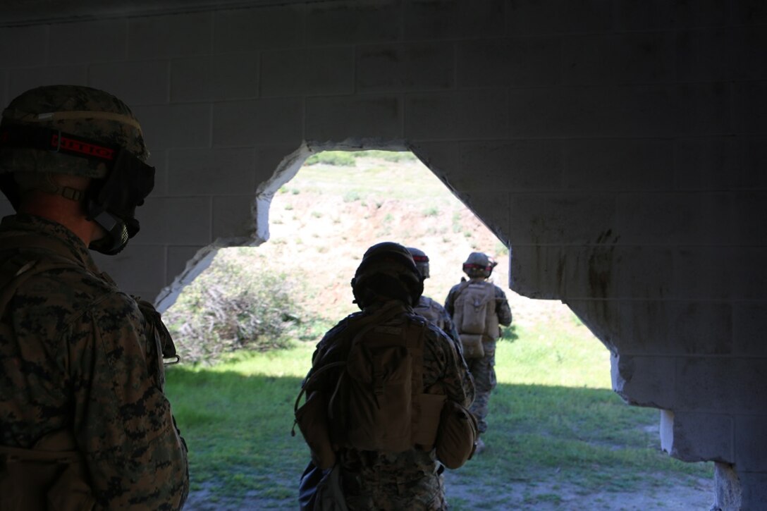 Marines with 1st Marine Division participate in a three-week urban operations course led by 1st Marine Division Schools, Urban Leaders Course at Camp Pendleton March 8, 2016. During the course, unit leaders cover urban terrain tactics like combat marksmanship, dynamic breaching, close quarters battle and room clearing. (U.S. Marine Corps photo by Lance Cpl. Justin E. Bowles/ Released)