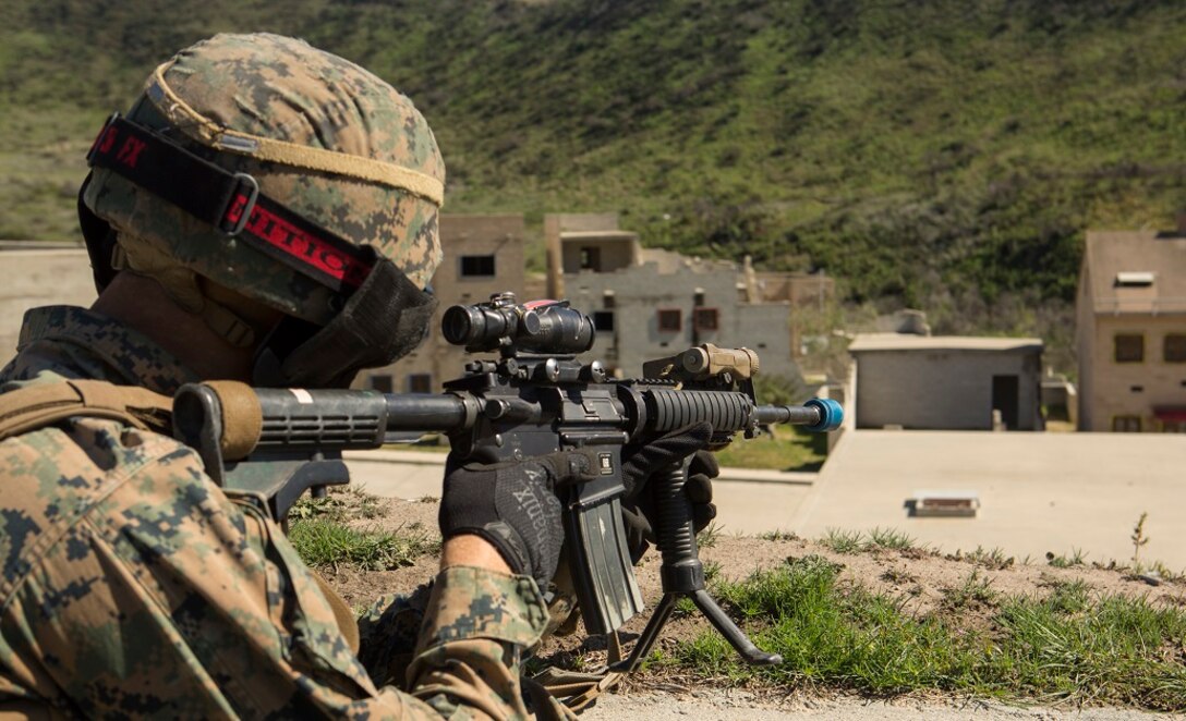 A Marine with 1st Marine Division sights in on a building during a three-week urban operations course led by 1st Marine Division Schools, Urban Leaders Course at Camp Pendleton March 8, 2016. During the course, unit leaders cover urban terrain tactics like combat marksmanship, dynamic breaching, close quarters battle and room clearing. (U.S. Marine Corps photo by Lance Cpl. Justin E. Bowles/ Released)