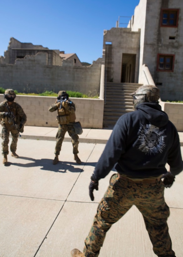 Marines with 1st Marine Division attempt to arrest a simulated enemy combatant during a three-week urban operations course led by 1st Marine Division Schools, Urban Leaders Course at Camp Pendleton March 8, 2016. During the course, unit leaders cover urban terrain tactics like combat marksmanship, dynamic breaching, close quarters battle and room clearing. (U.S. Marine Corps photo by Lance Cpl. Justin E. Bowles/ Released)
