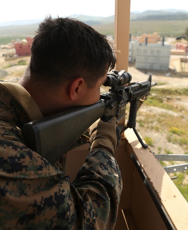 Lance Cpl. Anthony Ruiz provides simulated sniper rifle coverage during military operations on urban terrain at Camp Pendleton March 3, 2016. Marines with 1st Law Enforcement Battalion performed a five-day offensive training operation in an effort to better integrate military police officers with infantry units. Ruiz, a native of Sioux Falls, S.D., is a military policeman with Company B, 1st LE Bn., I Marine Expeditionary Force. (U.S. Marine Corps photo by Lance Cpl. Justin E. Bowles/Released)