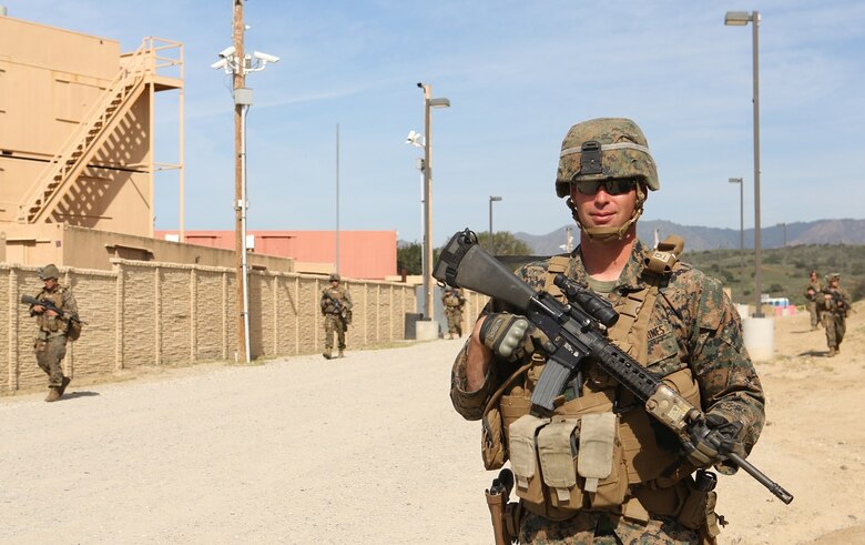 Cpl. Russ J. Bhyre walks in a tactical column with his squad during a patrol at Camp Pendleton March 3, 2016. Marines with 1st Law Enforcement Battalion performed a five-day offensive training evolution in an effort to better integrate military police officers with infantry units. Bhyre, a native of Minneapolis, is a military policeman with Company B, 1st LE Bn., I Marine Expeditionary Force. (U.S. Marine Corps photo by Lance Cpl. Justin E. Bowles/Released)