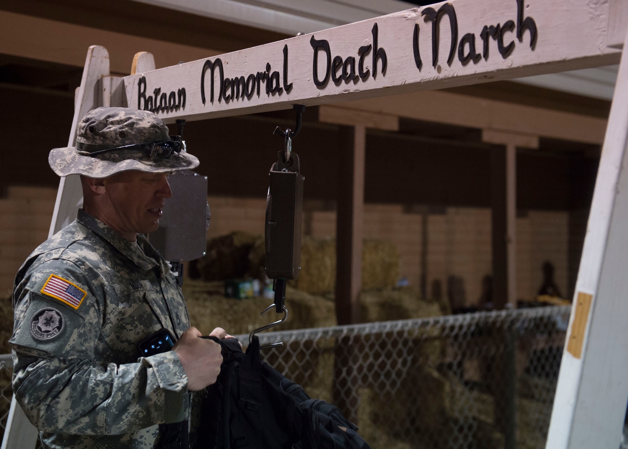 Participants of the Annual Bataan Memorial Death March weigh in their ruck sacks before the opening ceremonies at White Sands Missile Range N.M., March 20. Over 6,000 men, women and children signed up to run and walk in honor of the thousands of American and Filipino military members who were captured and forced to march for days in the scorching heat through the Philippine jungles on April 9, 1942. (U.S. Air Force photo by Senior Airman Chase Cannon)