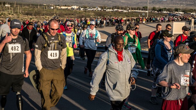 Participants of the Annual Bataan Memorial Death March start the first mile of either a 26.2 mile or 14.2 mile course at White Sands Missile Range N.M., March 20. Over 6,000 men, women and children signed up to run and walk in honor of the thousands of American and Filipino military members who were captured and forced to march for days in the scorching heat through the Philippine jungles on April 9, 1942. (U.S. Air Force photo by Senior Airman Chase Cannon)