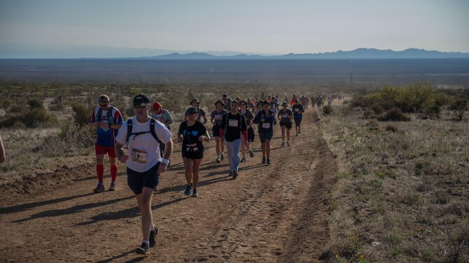 Participants in the 2016 Bataan Memorial Death March make their way through the course at White Sands Missile Range N.M., March 20. Over 6,200 participants came to honor more than 76,000 Prisoners of War and Missing in Action from Bataan and Corregidor during World War II. The 26.2-mile course starts on WSMR, enters hilly terrain and finishes through sandy desert trails, with elevation ranging from 4,100 to 5,300 feet. (U.S. Air Force photo by Senior Airman Chase Cannon)