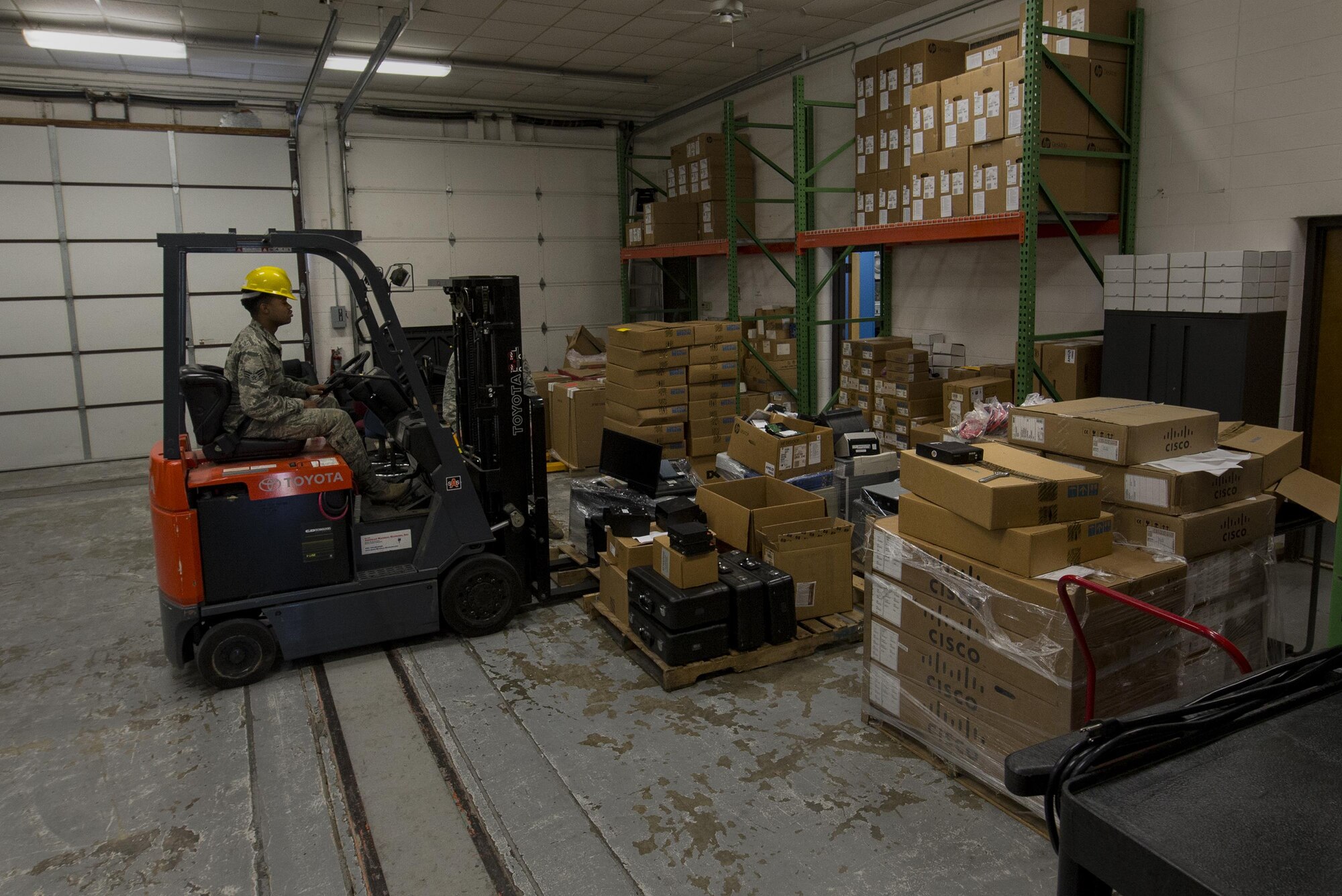 U.S. Air Force Senior Airman Jamanne Anderson, 23d Communications Squadron information technology asset management technician, organizes unusable computer equipment, March 22, 2016, at Moody Air Force Base, Ga. The 23d CS is tasked with accounting for and troubleshooting 250 hardware and software accounts various units on base. (U.S. Air Force photo by Airman Daniel Snider/Released)