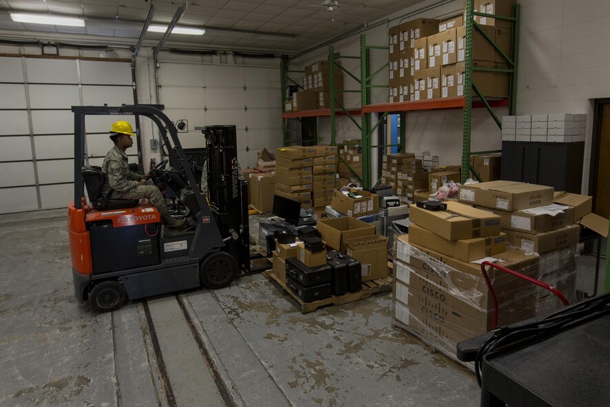 U.S. Air Force Senior Airman Jamanne Anderson, 23d Communications Squadron information technology asset management technician, organizes unusable computer equipment, March 22, 2016, at Moody Air Force Base, Ga. The 23d CS is tasked with accounting for and troubleshooting 250 hardware and software accounts various units on base. (U.S. Air Force photo by Airman Daniel Snider/Released)