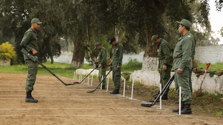 A Moroccan Royal Marine speaks to other military members prior to conducting a mine sweeping exercise in Kenitra, Morocco, March 15, 2016. Students from across the Moroccan military branches are working together with U.S. Marine and Utah Air National Guard explosive ordnance disposal technicians and Utah National Guard engineers to build up Morocco’s demining capabilities. The training is part of the U.S. Humanitarian Mine Action Program which has been assisting partner nations in developing their mine action capacity since 1988.