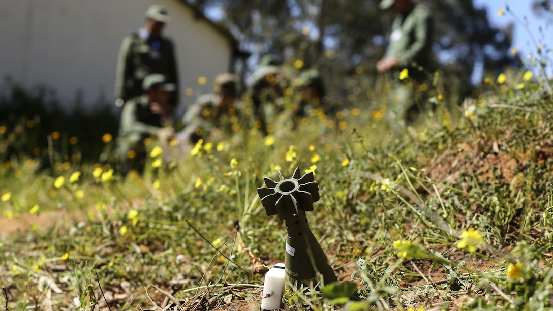 U.S. Marine Staff Sgt. Phil Mayer, an explosive ordnance disposal technician with Special-Purpose Marine Air-Ground Task Force Crisis Response-Africa, debriefs a group of future instructors during an ordnance reconnaissance training exercise in Kenitra, Morocco, March 16, 2016. Students from across the Moroccan military branches are working together with U.S. Marine and Utah Air National Guard explosive ordnance disposal technicians and Utah National Guard engineers to build up Morocco’s demining capabilities. The training is part of the U.S. Humanitarian Mine Action Program which has been assisting partner nations in developing their mine action capacity since 1988.