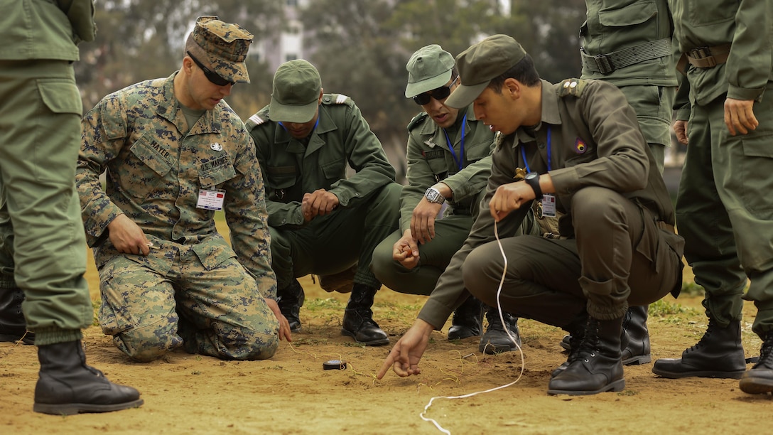 U.S. Marine Staff Sgt. Phil Mayer, an explosive ordnance disposal technician with Special-Purpose Marine Air-Ground Task Force Crisis Response-Africa, explains how to safely create electric firing circuits for demolition during a training exercise in Kenitra, Morocco, March 15, 2016. Students from across the Moroccan military branches are working together with U.S. Marine and Utah Air National Guard explosive ordnance disposal technicians and Utah National Guard engineers to build up Morocco’s demining capabilities. The training is part of the U.S. Humanitarian Mine Action Program which has been assisting partner nations in developing their mine action capacity since 1988. (U.S. Marine Corps photo by Cpl. Olivia McDonald/Released)