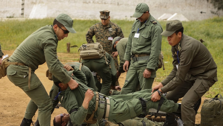 Moroccan soldiers ready a casualty for transport during a notional casualty training exercise in Kenitra, Morocco, March 15, 2016. Students from across the Moroccan military branches are working together with U.S. Marine and Utah Air National Guard explosive ordnance disposal technicians and Utah National Guard engineers to build up Morocco’s demining capabilities. The training is part of the U.S. Humanitarian Mine Action Program which has been assisting partner nations in developing their mine action capacity since 1988. 