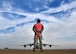 Senior Airman Cody Burdette, 445th Aircraft Maintenance Squadron aircraft mechanic, prepares to marshal a 445th Airlift Wing C-17 Globemaster III getting ready to leave its spot on the ramp for a local flight March 22, 2016. The clouds over the C-17 formed an “X” in the sky, matching the Airman’s marshalling wands as he stands ready to guide the aircraft. (U.S. Air Force photo/Tech. Sgt. Frank Oliver)