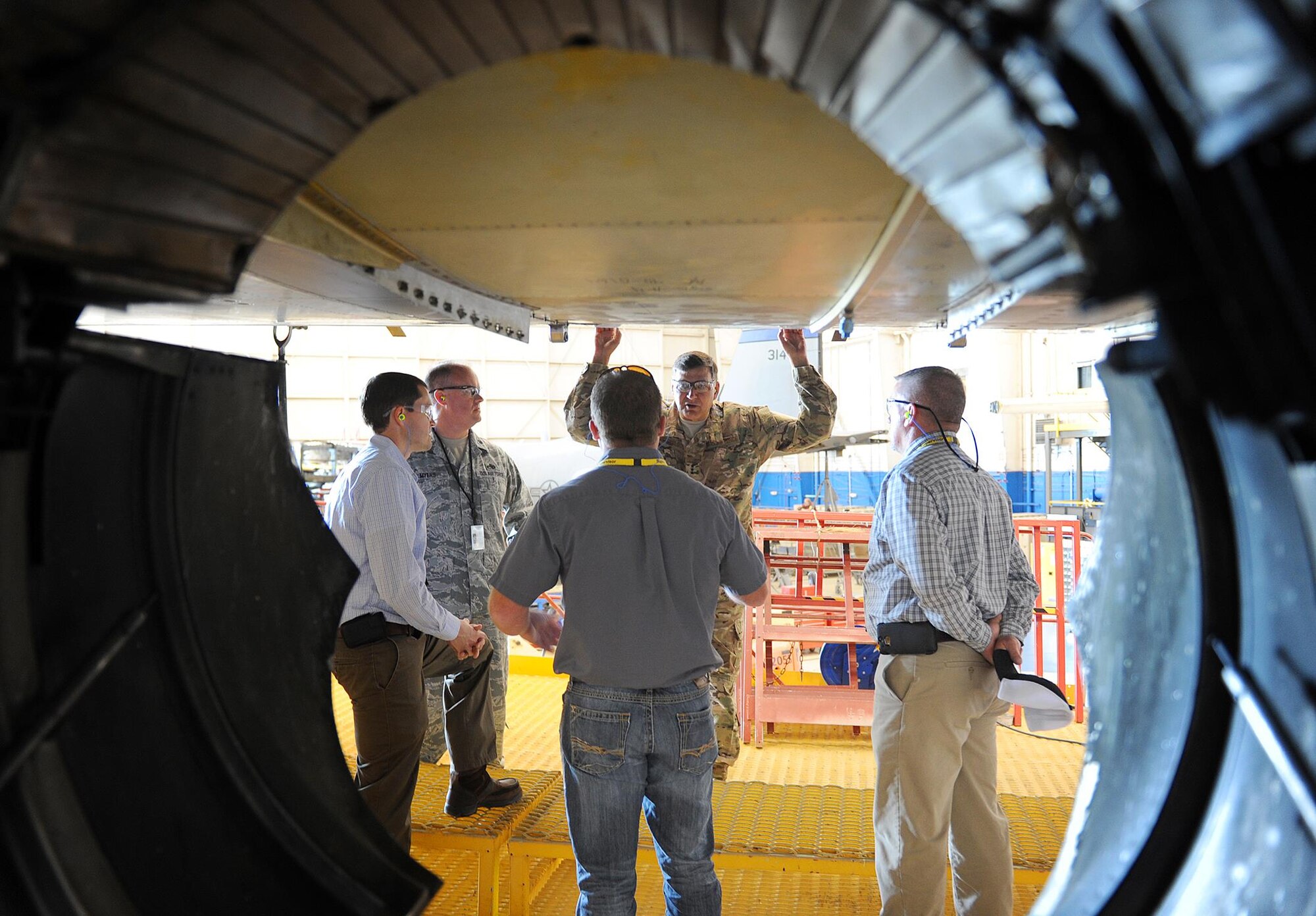 Lt. Gen. Brad Heithold, Air Force Special Operations Command commander, takes a moment to talk with members of the C-130 AFSOC acceleration flight during a tour of the production lines at Robins Air Force Base, Ga., March 22, 2016. During the tour, Heithold was briefed on the programmed depot maintenance plan, lessons learned, the production gate flow process and the status of current aircraft on station. (U.S. Air Force photo by Tommie Horton)