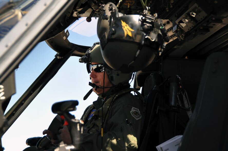 U.S. Air Force Major Gen. William Binger, left, talks to Staff Sgt. Shawn McBee, a 305th Rescue Squadron special mission aviator, on the flight line at Davis-Monthan Air Force Base, Ariz., March 9. Binger visited the 943rd Rescue Group to see its combat search and rescue mission firsthand. He is the Mobilization Assistant to the Deputy Chief of Staff for Operations, Headquarters U.S. Air Force, Washington, D.C. (U.S. Air Force photo by Carolyn Herrick)
