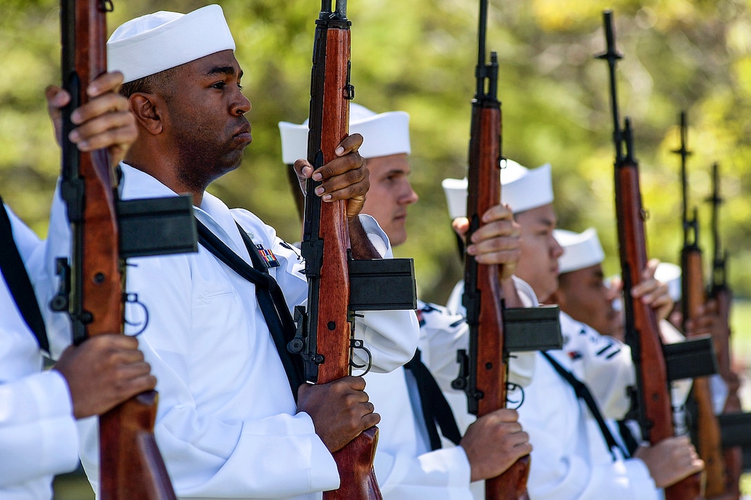 Sailors perform a rifle salute during a reinterment ceremony for Navy Ensign Lewis Stockdale, who was killed during the attack on Pearl Harbor, at the National Memorial Cemetery of the Pacific at Punchbowl in Honolulu, March 18, 2016. Stockdale’s remains recently were identified and he was buried with full military honors. The sailors are assigned to Joint Base Pearl Harbor-Hickam Honors and Ceremonies. Navy photo by Mass Petty Officer 2nd Class Laurie Dexter