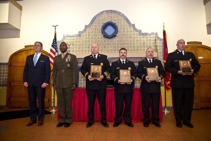 Randy Smith, assistant deputy commandant for Plans, Policies, and Operations (PP&O), and Lt. Gen. Ronald Bailey, deputy commandant for PP&O, pose with MCBQ fire and emergency services personnel Capt. David Williams, Sgt. Cliff Burton, Sgt. Jimmy Thacker and Firefighter Don Perry, who received ther 2015 Security and Emergency Services Lifesaving Awards in San Diego, Calif., on Mar. 8.