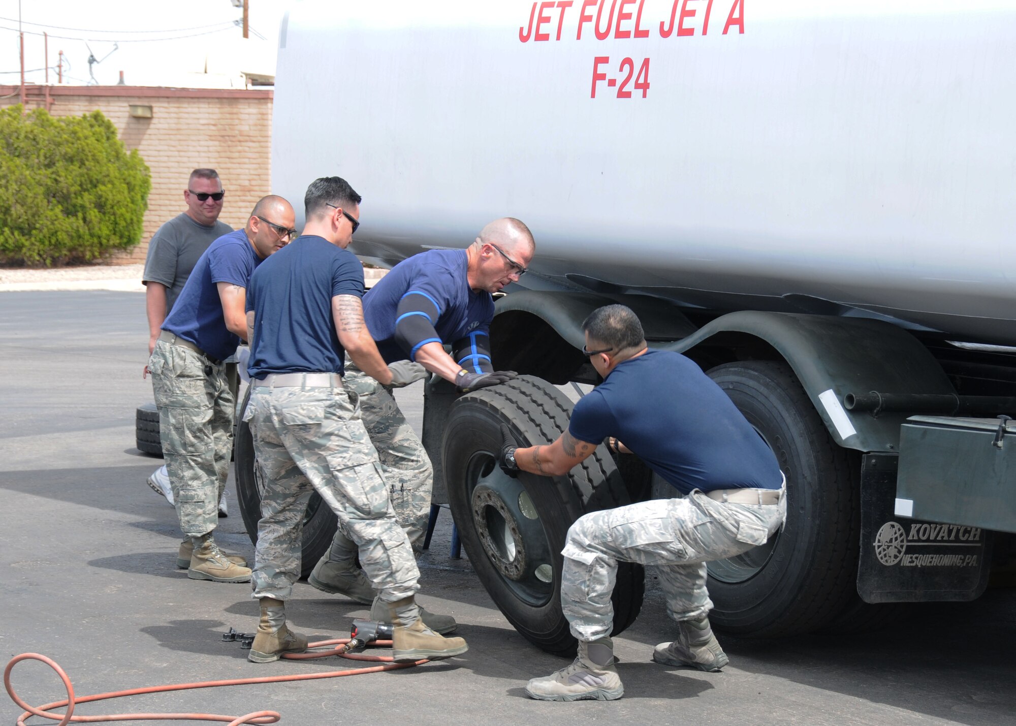 Fuels Specialist from the 944th LRS, Luke Air Force Base, compete in a tire changing competition during the POL (Petroleum, Oils and Lubricants) Roadeo held at Luke Air Force Base, Arizona last year. (U.S. Air Force photo by Staff Sgt. Joshua Nason)


