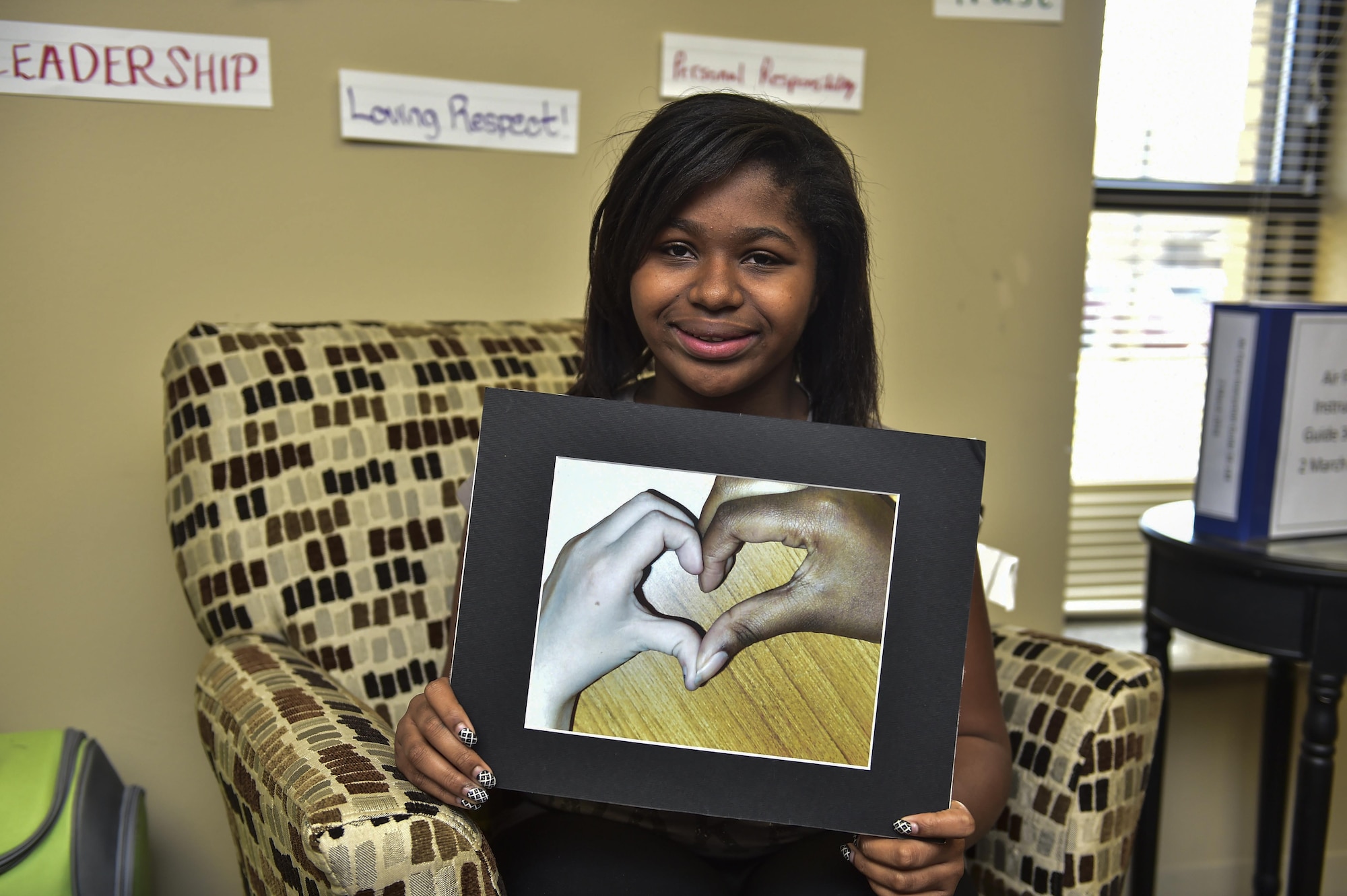 Zayiah Craig, 11, displays her award-winning photo, titled “Best Friends Forever,” at the Hurlburt Field Youth Center, March 14, 2016. Craig entered her photo into a national photography contest, organized by the Boys and Girls Club of America where she competed against all B&GCA nominations to include all youth programs across the entire Air Force, Army, Navy, Marines and Coast Guard. (U.S. Air Force photo by Senior Airman Jeff Parkinson)
