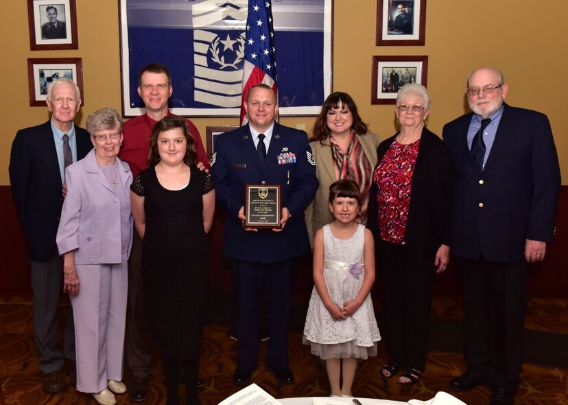 Tech. Sgt. Timothy Rosio, 944th Fighter Wing Detachment 1 Maintenance Unit weapons load crew chief, poses with family members of the late Tech. Sgt. Graydon Williams Mar. 16 during the Graydon Williams Award Ceremony at Luke Air Force Base, Ariz. (U.S. Air Force photo by Tech. Sgt. Louis Vega Jr.)