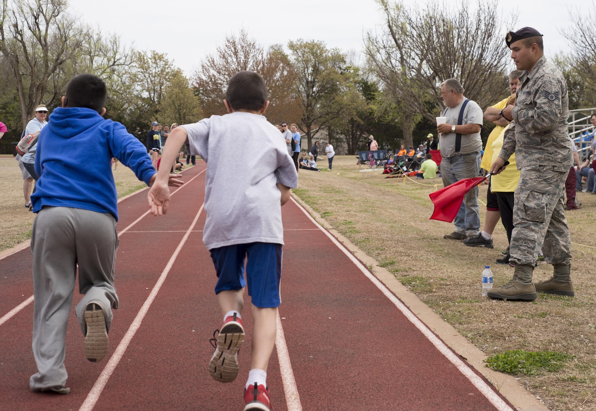 Two Special Olympians begin a 50-yard run March 23 at Vance Air Force Base during the 46th Annual Cherokee Strip Area 6 Special Olympics. More than 200 athletes competed in the games and the winners will compete in the Special Olympics Oklahoma games this summer. (U.S. Air Force photo/ David Poe)