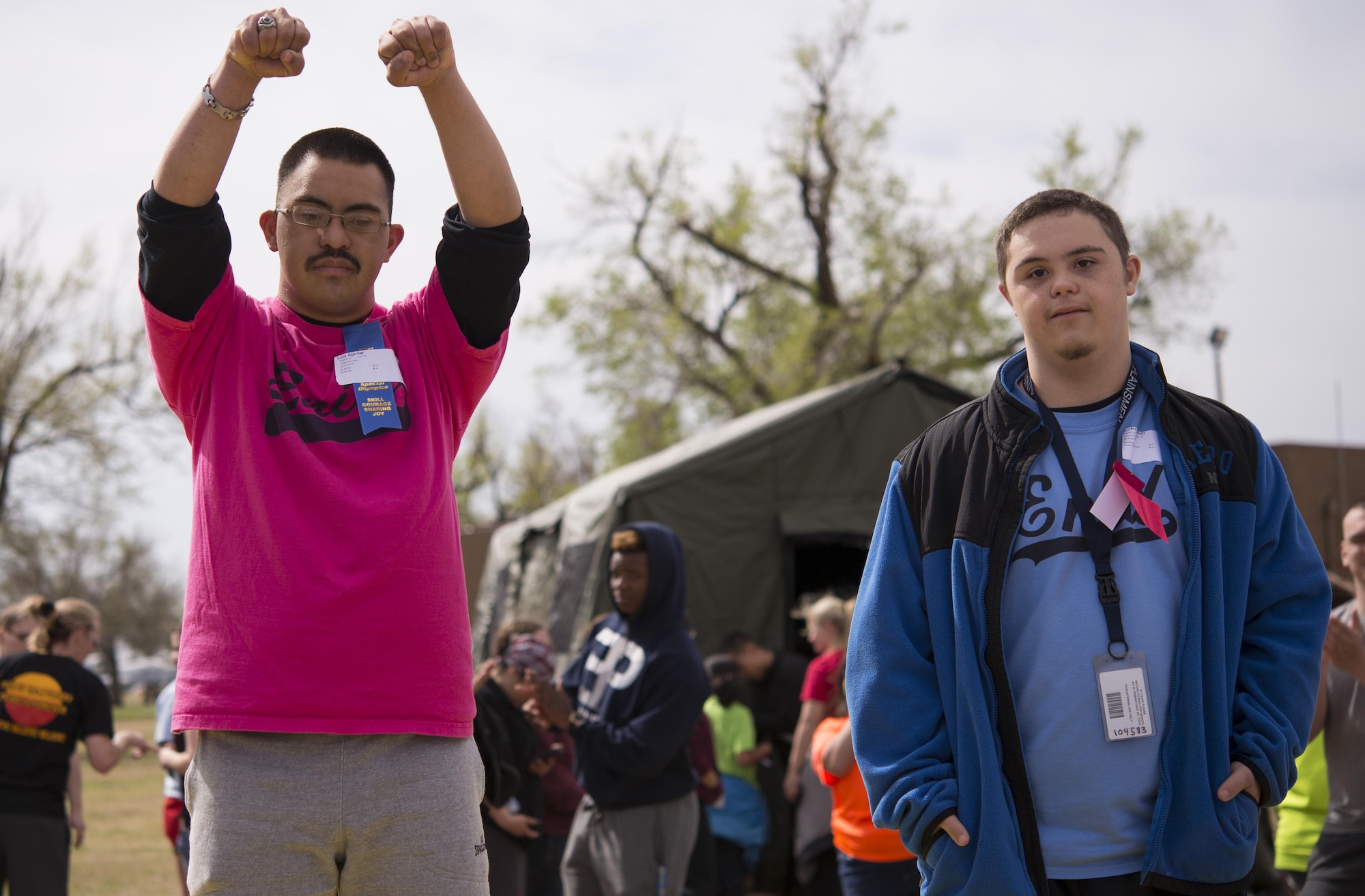 Special Olympians celebrate completion of a track and field event at the 46th Annual Cherokee Strip Area 6 Special Olympics at Vance Air Force Base, Oklahoma, March 23. More than 200 athletes competed in the games and the winners will compete in the Special Olympics Oklahoma games this summer. (U.S. Air Force photo/ David Poe)
