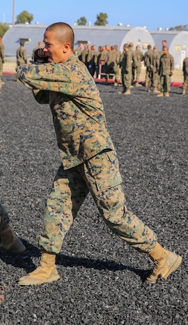 A recruit of Mike Company, 3rd Recruit Training Battalion, conducts a horizontal elbow strike during a Marine Corps Martial Arts Program Test at Marine Corps Recruit Depot San Diego, March 23. One of the first things recruits learn during MCMAP is the basic warrior stance, which serves as the position from which each technique begins. Annually, more than 17,000 males recruited from the Western Recruiting Region are trained at MCRD San Diego. Mike Company is scheduled to graduate April 15.