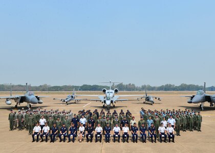 Military members from the Republic of Singapore Air Force, Royal Thai Air Force and U.S. Air Force mark the conclusion of Exercise Cope Tiger 16 on Korat Royal Thai Air Force Base, Thailand, March 18, 2016. The multilateral exercise involved over 1,200 personnel from three countries and a combined total of 87 aircraft that completed 1,003 sorts over two weeks. In addition, trilateral civic assistance programs conducted during Cope Tiger 16 helped to promote good relationships between the three countries’ forces and Thai communities near Korat Royal Thai Air Force Base. I Cope Tiger, which is in its 22nd year, is an annual multilateral aerial exercise supporting regional peace and security by improving readiness and multinational interoperability between the Republic of Singapore Air Force, Royal Thai Air Force, and U.S. Air Force. (U.S. Air Force Photo by Tech Sgt. Aaron Oelrich/Released)