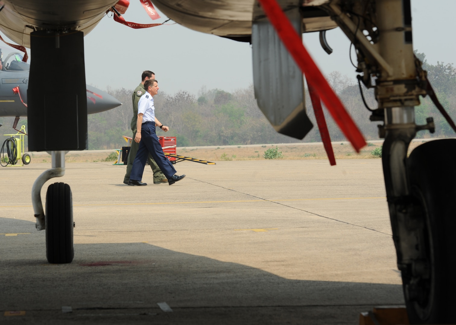 Maj. Gen. Micheal Compton, Air National Guard assistant to the commander at Pacific Air Forces, Joint Base Pearl Harbor-Hickam, Hawaii, walks next to Lt. Col. Jack Arthaud, Cope Tiger 16 exercise director for the U.S. Air Force, prior to the closing ceremony of Exercise Cope Tiger 16 on Korat Royal Thai Air Force Base, Thailand, March 18, 2016. Exercise Cope Tiger 16 included over 1,200 personnel from three countries and continued the growth of strong, interoperable and beneficial relationships within the Asia-Pacific Region, while demonstrating U.S. capability to project forces strategically in a combined, joint environment. (U.S. Air Force Photo by Tech Sgt. Aaron Oelrich/Released)