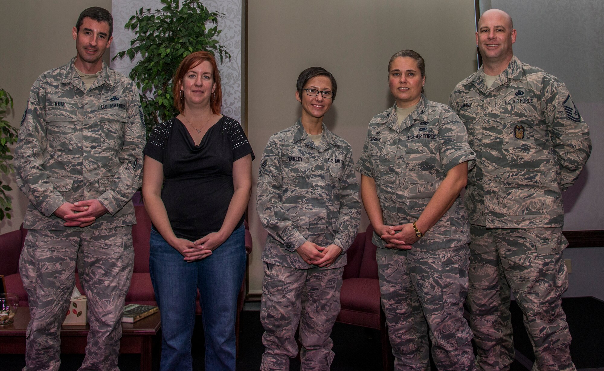 (From left to right) Master Sgt. Daniel Kriz, April Honaker, Senior Airman Nikitta Oakley, Col. Linda Hurry, and Master Sgt. Gustav Dumann pose for a photo on stage after speaking at the Storytellers event, Mar. 15 at the Scott Event Center at Scott Air Force Base, Ill. Storytellers in a less formal setting where speakers can tell their stories of perseverance and resiliency. (U.S. Air Force Photo by Airman Daniel Garcia)