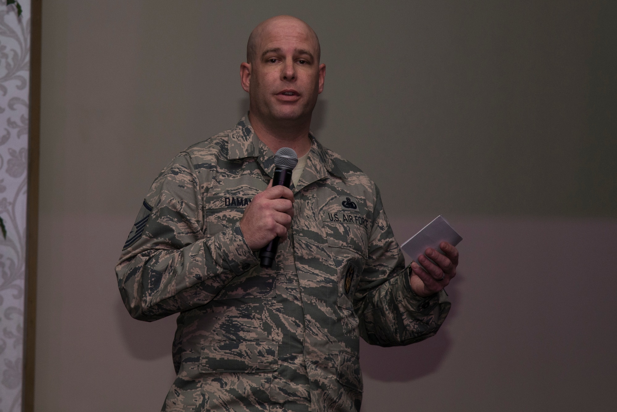 Master Sgt. Gustav Dumann, Air Mobility Command Inspector General command fuels inspector, speaks about recovering from PTSD after being hit by a suicide car bomb whille on deployment, during the Storytellers event Mar. 15 at the Scott Event Center at Scott Air Force Base, Ill. Storytellers in a less formal setting where speakers can tell their stories of perseverance and resiliency. (U.S. Air Force Photo by Airman Daniel Garcia)