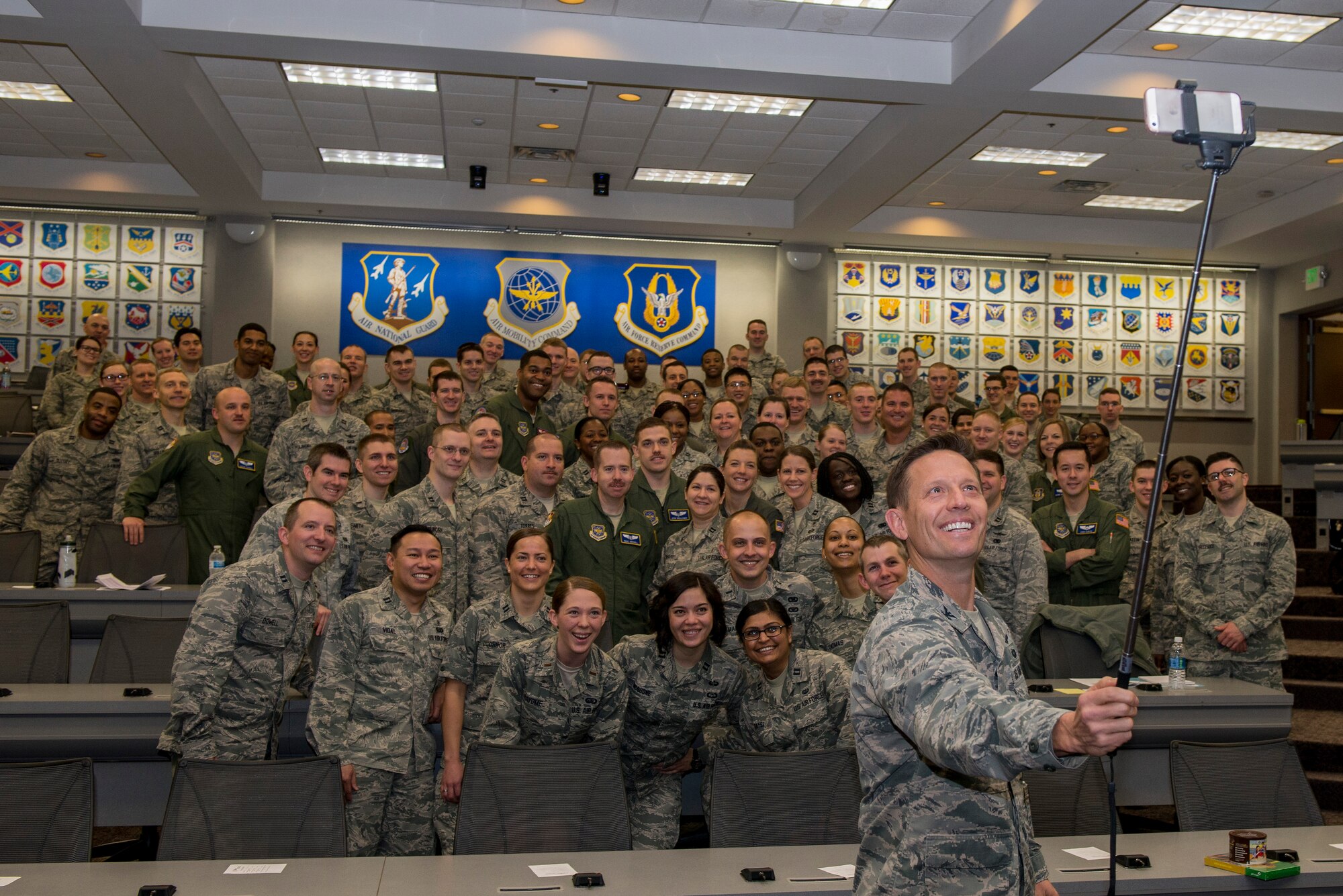Col. Gregory Green, 375th Air Mobility Wing vice commander, takes a selfie with the Company Grade Officers March 16, 2016 at the CGOC. Company Grade Officers are ranks 1st and 2nd Lieutenant as well as Captain. (U.S. Air Force Photo/Senior Airman Joshua Eikren)