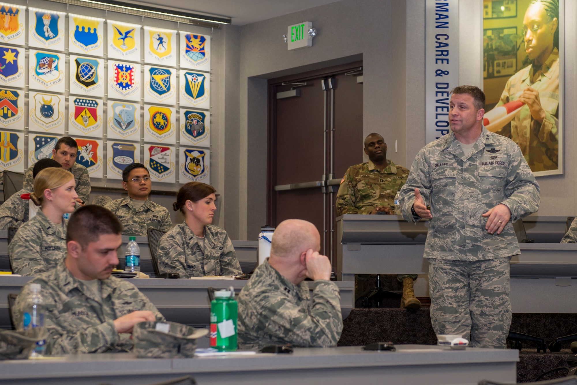 Maj. Gen. Thomas Sharpy, Air Mobility Command, talks to Company Grade Officers about their future in the Air Force and how they can succeed March 16, 2016 at the CGOC. The CGOC was open to all CGOs from Scott AFB, Fort Leonard Wood, Fort Campbell, Whiteman AFB and all ROTC detachments from surrounding schools and recruiting squadrons. (U.S. Air Force Photo/Senior Airman Joshua Eikren)