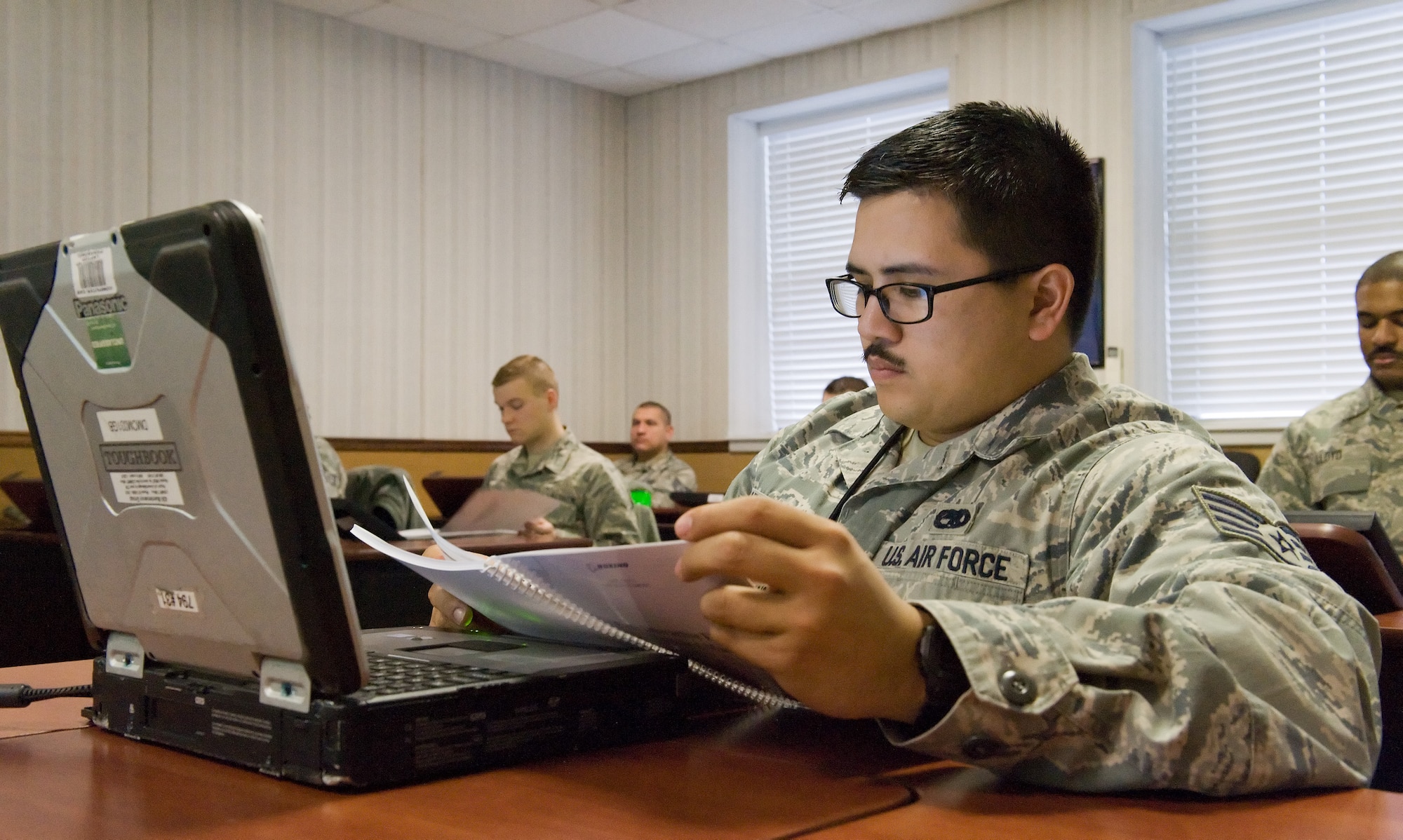 Staff Sgt. Sean Carlson, 736th Aircraft Maintenance Squadron C-17A Globemaster III communication/countermeasures/navigation systems craftsman, looks over a training guide for the C-17 Interactive Electronic Manuals Feb. 24, 2016, on Dover Air Force Base, Del. The C-17 IETM is a full and inclusive suite of organizational level maintenance in one single electronic technical order consisting of job guides, fault isolation, illustrated parts breakdown, etc. (U.S. Air Force photo/Roland Balik)