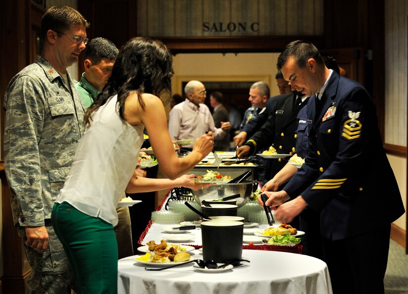National Prayer Luncheon attendees sample the buffet line March 17, 2016 at the Charleston Club. The National Prayer Luncheon is an annual event bringing community members and service members together for prayer and fellowship..