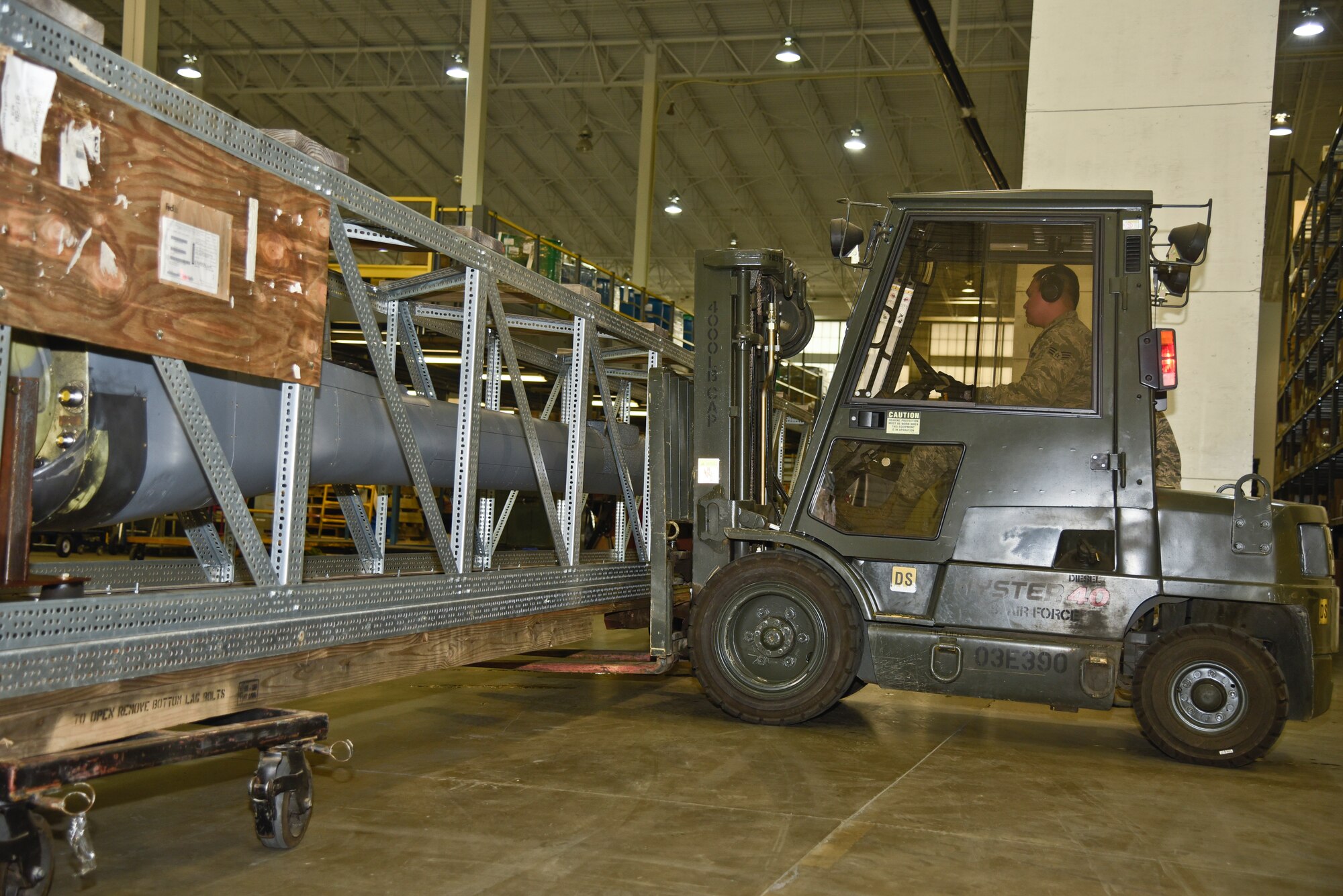 Senior Airman Johnraphael Navarro, 92nd Logistics Readiness Squadron traffic management journeyman, operates a forklift March 22, 2016, at Fairchild Air Force Base, Wash. Navarro is moving a boom from a KC-135 Stratotanker, the Traffic Management Office is responsible for shipping and receiving all assets on the base. (U.S Air Force photo/Airman 1st Class Taylor Bourgeous)